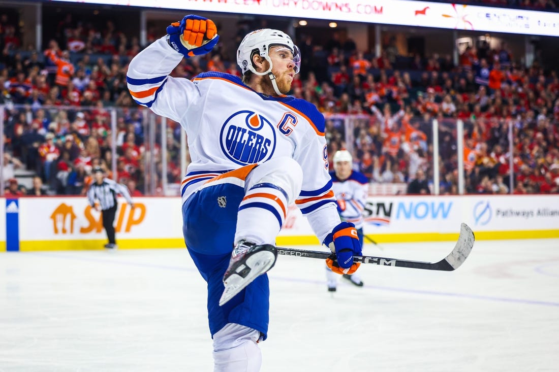 Dec 27, 2022; Calgary, Alberta, CAN; Edmonton Oilers center Connor McDavid (97) celebrates his goal against the Calgary Flames during the third period at Scotiabank Saddledome. Mandatory Credit: Sergei Belski-USA TODAY Sports