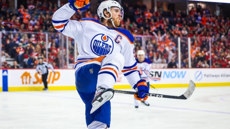 Dec 27, 2022; Calgary, Alberta, CAN; Edmonton Oilers center Connor McDavid (97) celebrates his goal against the Calgary Flames during the third period at Scotiabank Saddledome. Mandatory Credit: Sergei Belski-USA TODAY Sports