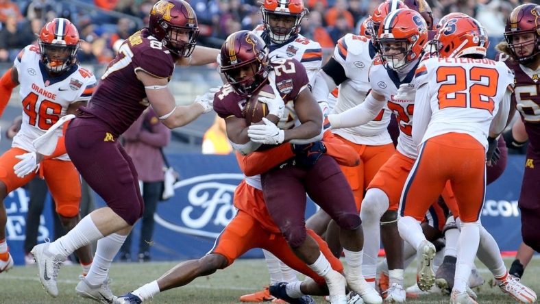 Dec 29, 2022; Bronx, NY, USA; Minnesota Golden Gophers running back Mohamed Ibrahim (24) runs for a touchdown against the Syracuse Orange during the second quarter of the 2022 Pinstripe Bowl at Yankee Stadium. Mandatory Credit: Brad Penner-USA TODAY Sports