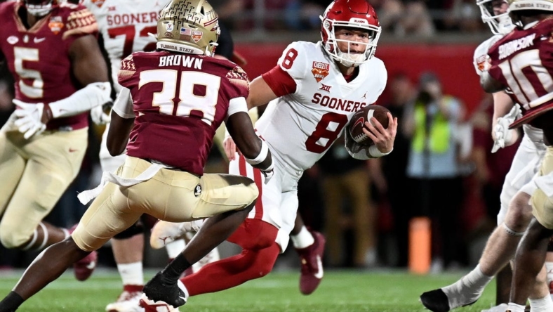 Dec 29, 2022; Orlando, Florida, USA; Oklahoma Sooners quarterback Gabriel Dillon (8) runs the ball in the first quarter against the Florida State Seminoles in the 2022 Cheez-It Bowl at Camping World Stadium. Mandatory Credit: Jonathan Dyer-USA TODAY Sports