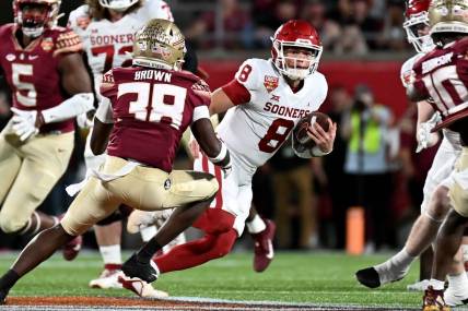 Dec 29, 2022; Orlando, Florida, USA; Oklahoma Sooners quarterback Gabriel Dillon (8) runs the ball in the first quarter against the Florida State Seminoles in the 2022 Cheez-It Bowl at Camping World Stadium. Mandatory Credit: Jonathan Dyer-USA TODAY Sports