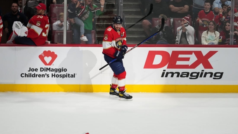 Dec 29, 2022; Sunrise, Florida, USA; Florida Panthers center Aleksander Barkov (16) celebrates his third goal of the game during the first period for a hat-trick against the Montreal Canadiens at FLA Live Arena. Mandatory Credit: Jasen Vinlove-USA TODAY Sports