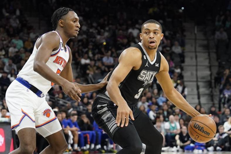 Dec 29, 2022; San Antonio, Texas, USA; San Antonio Spurs forward Keldon Johnson (3) drives to the basket against New York Knicks guard Immanuel Quickley (5) during the first half at AT&T Center. Mandatory Credit: Scott Wachter-USA TODAY Sports
