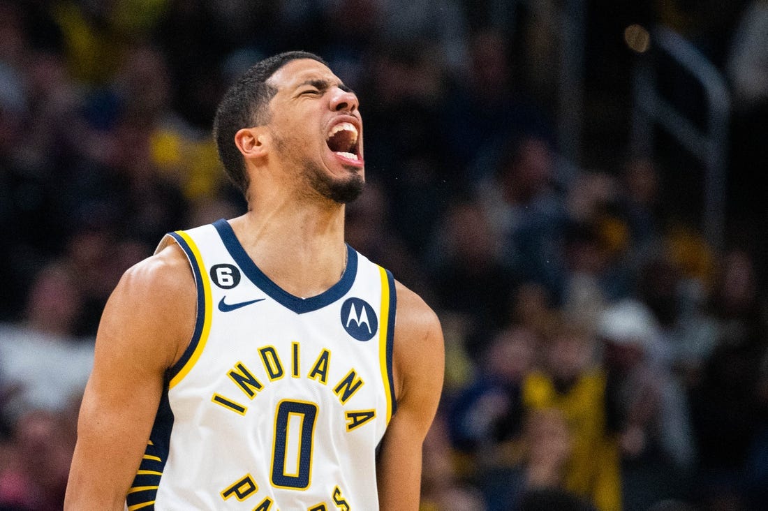 Dec 29, 2022; Indianapolis, Indiana, USA; Indiana Pacers guard Tyrese Haliburton (0) reacts to a made basket in the second half against the Cleveland Cavaliers at Gainbridge Fieldhouse. Mandatory Credit: Trevor Ruszkowski-USA TODAY Sports