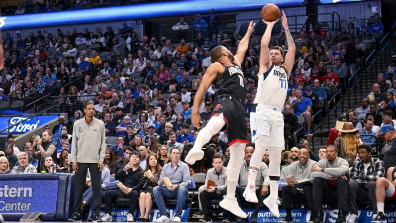 Dec 29, 2022; Dallas, Texas, USA; Dallas Mavericks guard Luka Doncic (77) shoots over Houston Rockets guard Eric Gordon (10) during the second half at the American Airlines Center. Mandatory Credit: Jerome Miron-USA TODAY Sports