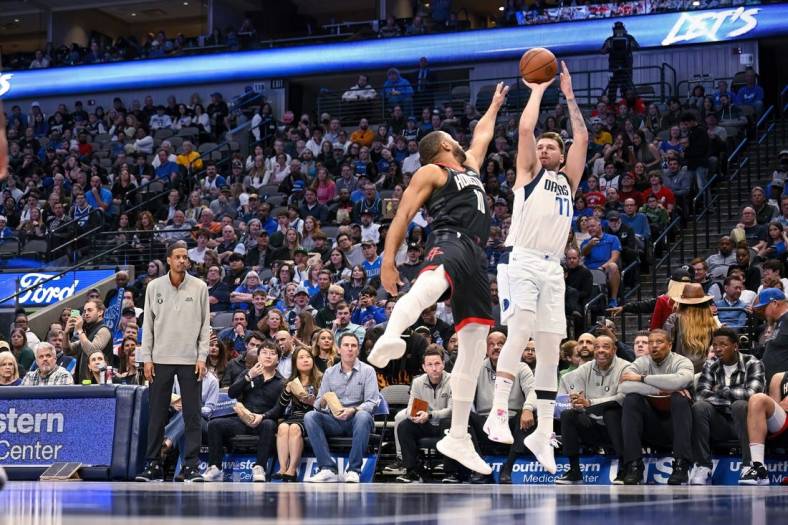 Dec 29, 2022; Dallas, Texas, USA; Dallas Mavericks guard Luka Doncic (77) shoots over Houston Rockets guard Eric Gordon (10) during the second half at the American Airlines Center. Mandatory Credit: Jerome Miron-USA TODAY Sports