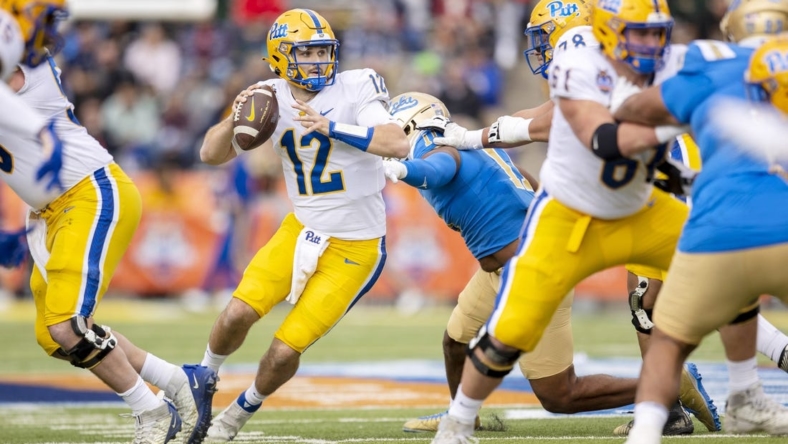 Dec 30, 2022; El Paso, Texas, USA; Pittsburgh Panthers quarterback Nick Patti (12) throws the ball against the UCLA Bruins defense in the first half of the 2022 Sun Bowl at Sun Bowl. Mandatory Credit: Ivan Pierre Aguirre-USA TODAY Sports