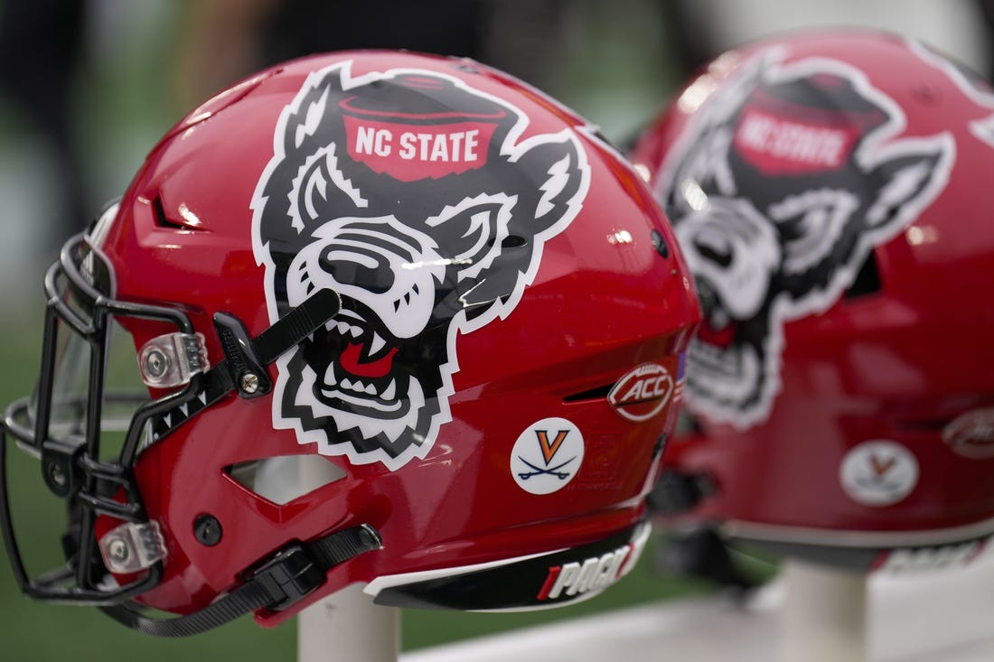 Dec 30, 2022; Charlotte, NC, USA; North Carolina State Wolfpack helmets during the first half against the Maryland Terrapins in the 2022 Duke's Mayo Bowl at Bank of America Stadium. Mandatory Credit: Jim Dedmon-USA TODAY Sports