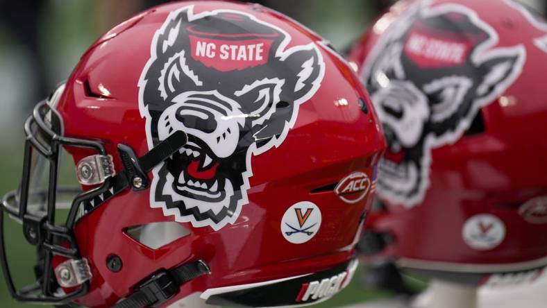 Dec 30, 2022; Charlotte, NC, USA; North Carolina State Wolfpack helmets during the first half against the Maryland Terrapins in the 2022 Duke's Mayo Bowl at Bank of America Stadium. Mandatory Credit: Jim Dedmon-USA TODAY Sports