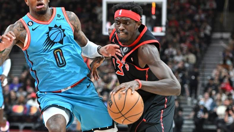 Dec 30, 2022; Toronto, Ontario, CAN; Toronto Raptors forward Pascal Siakam (43) dribbles the ball past Phoenix Suns forward Torrey Craig (0) in the first half at Scotiabank Arena. Mandatory Credit: Dan Hamilton-USA TODAY Sports