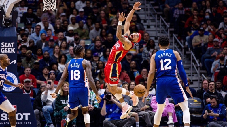 Dec 30, 2022; New Orleans, Louisiana, USA; New Orleans Pelicans guard Jose Alvarado (15) reacts after being fouled by Philadelphia 76ers guard Shake Milton (18) during the first half at Smoothie King Center. Mandatory Credit: Stephen Lew-USA TODAY Sports