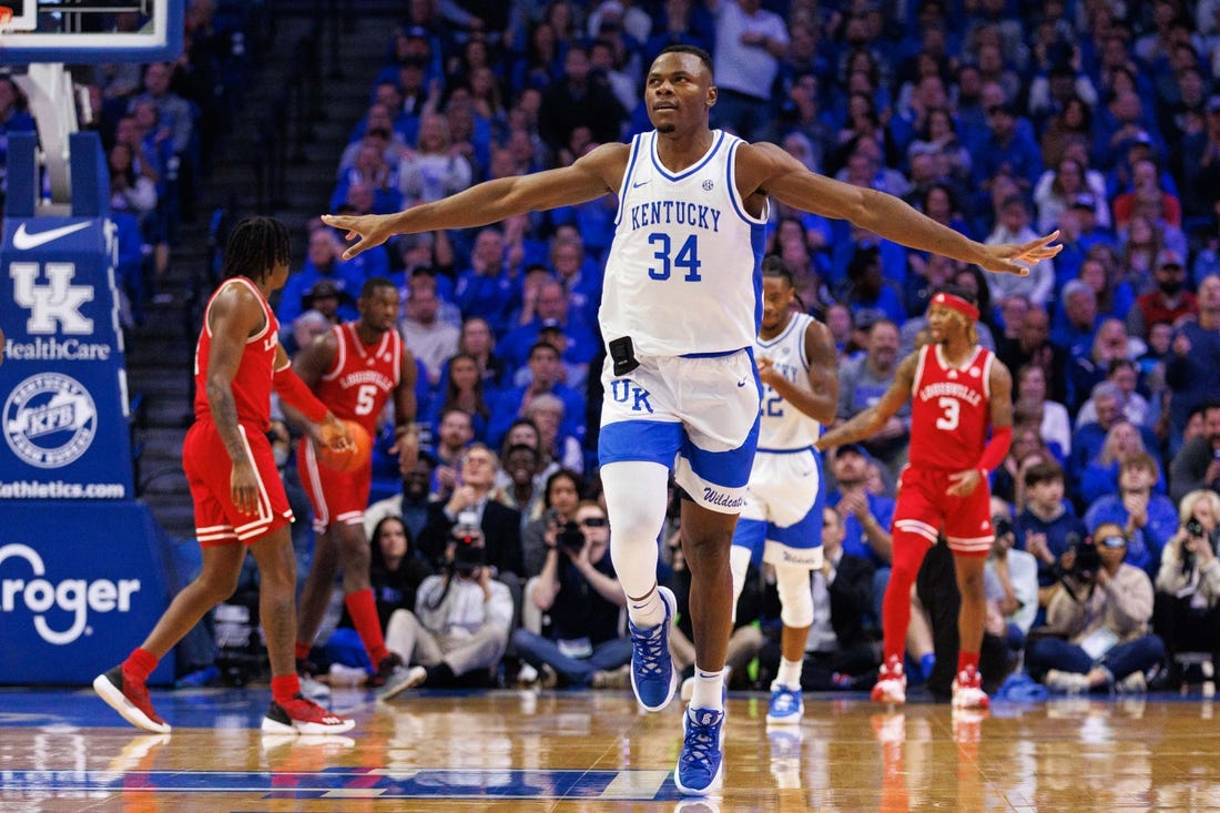 Dec 31, 2022; Lexington, Kentucky, USA; Kentucky Wildcats forward Oscar Tshiebwe (34) celebrates during the first half against the Louisville Cardinals at Rupp Arena at Central Bank Center. Mandatory Credit: Jordan Prather-USA TODAY Sports