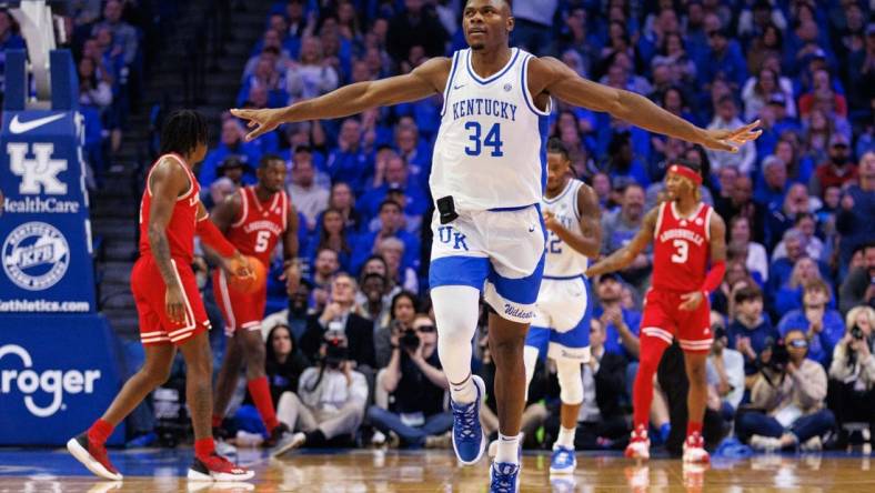 Dec 31, 2022; Lexington, Kentucky, USA; Kentucky Wildcats forward Oscar Tshiebwe (34) celebrates during the first half against the Louisville Cardinals at Rupp Arena at Central Bank Center. Mandatory Credit: Jordan Prather-USA TODAY Sports