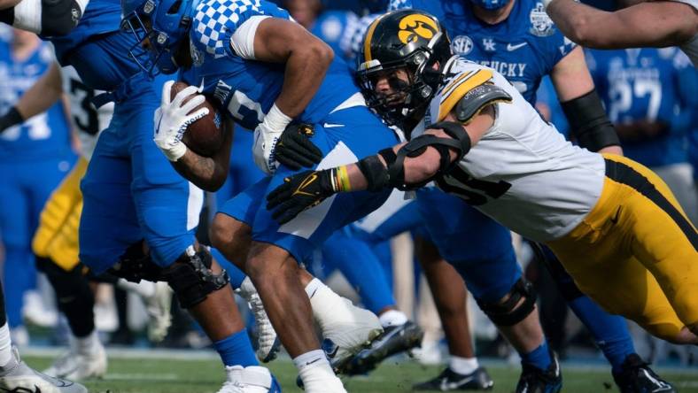 Kentucky running back JuTahn McClain (17) is stopped by Iowa linebacker Jack Campbell (31) during the first quarter of the TransPerfect Music City Bowl at Nissan Stadium Saturday, Dec. 31, 2022, in Nashville, Tenn.

Ncaa Football Music City Bowl Iowa At Kentucky

Syndication The Tennessean