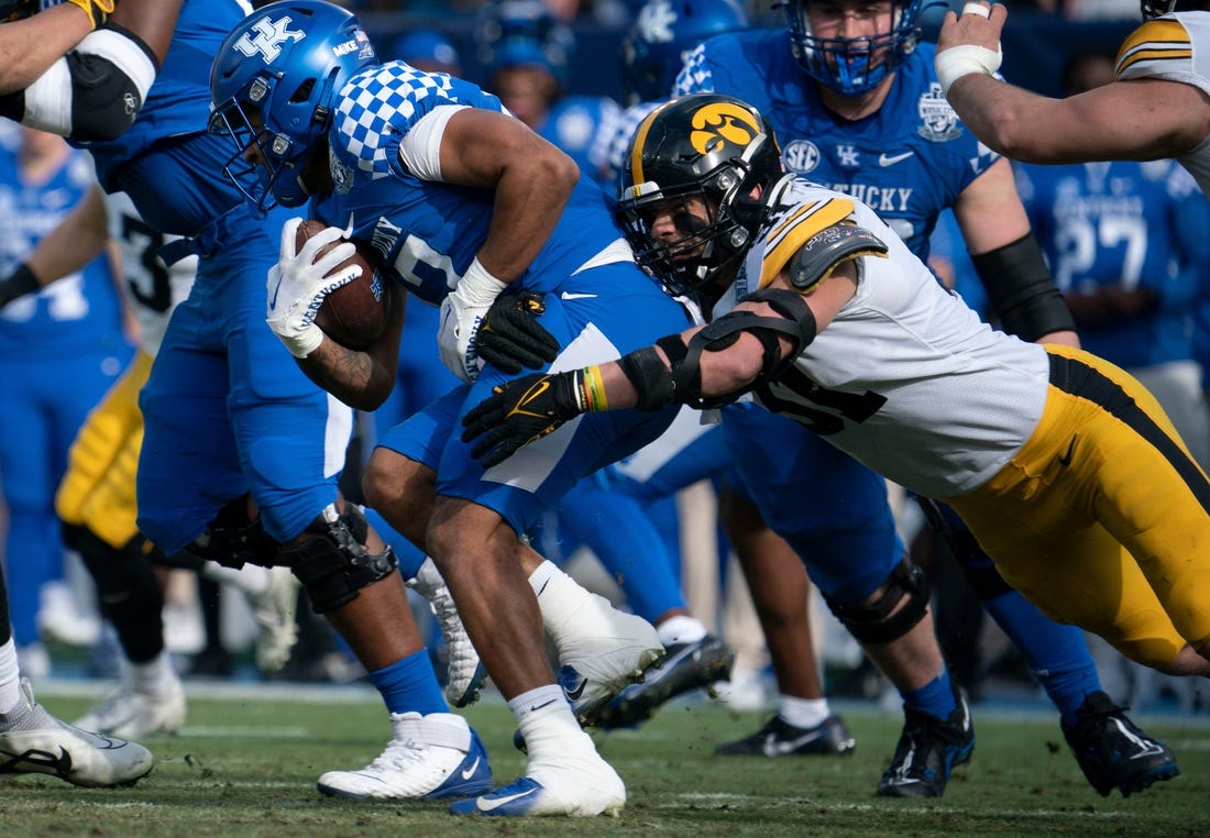 Kentucky running back JuTahn McClain (17) is stopped by Iowa linebacker Jack Campbell (31) during the first quarter of the TransPerfect Music City Bowl at Nissan Stadium Saturday, Dec. 31, 2022, in Nashville, Tenn.

Ncaa Football Music City Bowl Iowa At Kentucky

Syndication The Tennessean