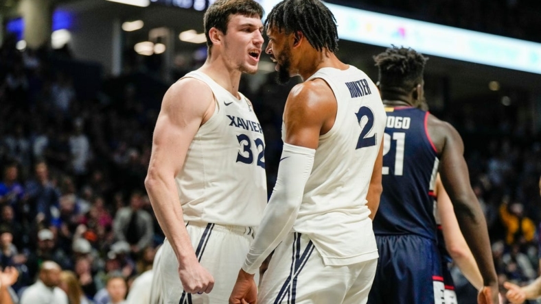 Xavier Musketeers forward Zach Freemantle (32) and  Jerome Hunter (2) celebrate after Hunter is fouled by the Connecticut Huskies Saturday, December 31, 2022 at the Cintas Center. The Musketeers upset the Huskies 83-73.

Xavier Uconn10