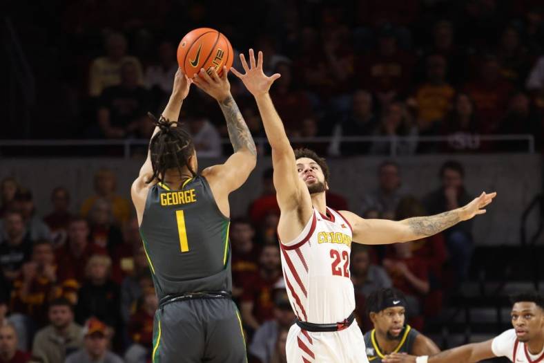 Dec 31, 2022; Ames, Iowa, USA; Iowa State Cyclones guard Gabe Kalscheur (22) defends the shot from Baylor Bears guard Keyonte George (1) at James H. Hilton Coliseum. Mandatory Credit: Reese Strickland-USA TODAY Sports