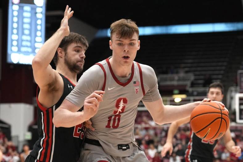 Dec 31, 2022; Stanford, California, USA; Stanford Cardinal forward Max Murrell (10) dribbles against Utah Utes guard Rollie Worster (25) during the first half at Maples Pavilion. Mandatory Credit: Darren Yamashita-USA TODAY Sports