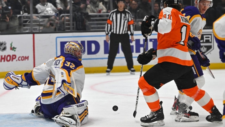 Dec 31, 2022; Los Angeles, California, USA;  Los Angeles Kings goaltender Jonathan Quick (32) makes a save off a shot by Philadelphia Flyers right wing Travis Konecny (11) in the first period of the game at Crypto.com Arena. Mandatory Credit: Jayne Kamin-Oncea-USA TODAY Sports