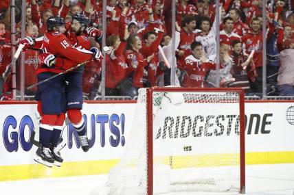 Apr 13, 2019; Washington, DC, USA; Washington Capitals right wing Tom Wilson (43) celebrates with Capitals center Nicklas Backstrom (19) after scoring a goal against the Carolina Hurricanes in the third period in game two of the first round of the 2019 Stanley Cup Playoffs at Capital One Arena. The Capitals won 4-3 in overtime. Mandatory Credit: Geoff Burke-USA TODAY Sports