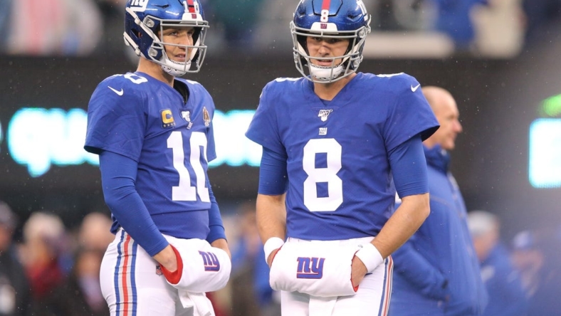 Dec 29, 2019; East Rutherford, New Jersey, USA; New York Giants quarterbacks Eli Manning (10) and Daniel Jones (8) warm up prior to their game against the Philadelphia Eagles at MetLife Stadium. Mandatory Credit: Brad Penner-USA TODAY Sports