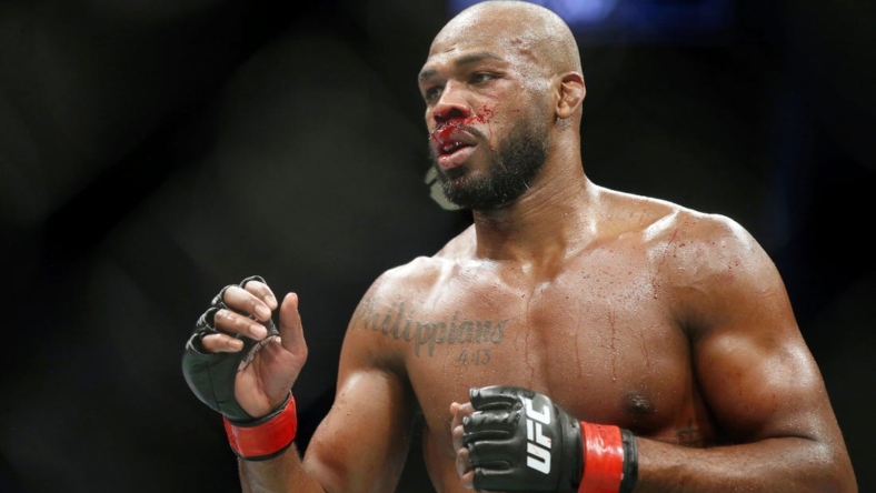 Feb 8, 2020; Houston, Texas, USA; Jon Jones (red gloves) fights Dominick Reyes (not pictured) during UFC 247 at Toyota Center. Mandatory Credit: Thomas Shea-USA TODAY Sports