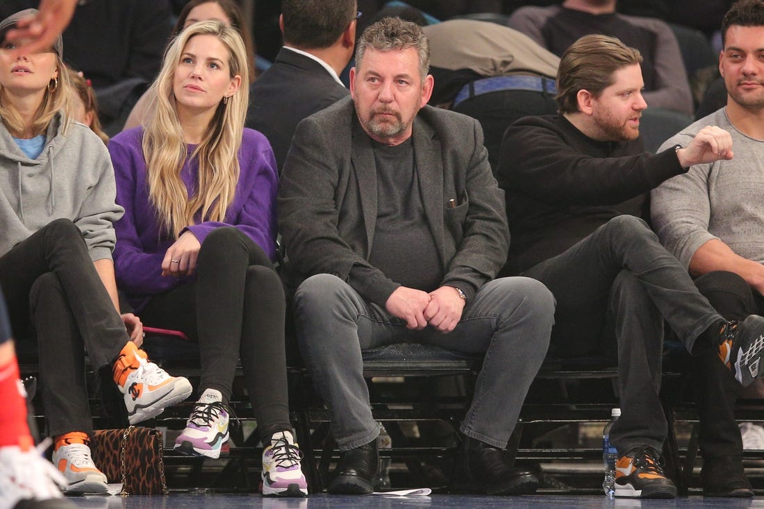 Feb 12, 2020; New York, New York, USA; New York Knicks executive chairman James Dolan (center) watches the game during the first quarter against the Washington Wizards at Madison Square Garden. Mandatory Credit: Brad Penner-USA TODAY Sports
