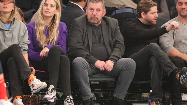 Feb 12, 2020; New York, New York, USA; New York Knicks executive chairman James Dolan (center) watches the game during the first quarter against the Washington Wizards at Madison Square Garden. Mandatory Credit: Brad Penner-USA TODAY Sports