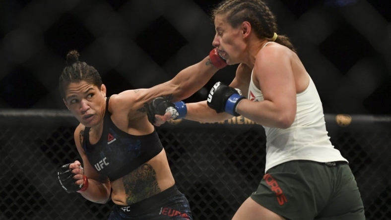 May 13, 2020; Jacksonville, Florida, USA; Sijara Eubanks (red gloves) fights Sarah Moras (blue gloves) during UFC Fight Night at VyStar Veterans Memorial Arena. Mandatory Credit: Jasen Vinlove-USA TODAY Sports