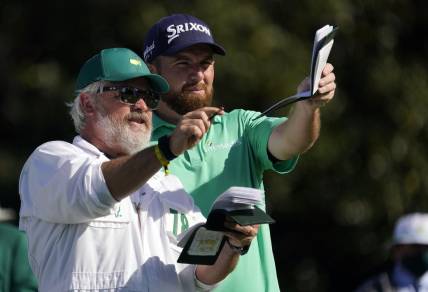 Nov 12, 2020; Augusta, Georgia, USA; Shane Lowry looks down the tenth fairway with his caddie Brian Martin during the first round of The Masters golf tournament at Augusta National GC. Mandatory Credit: Rob Schumacher-USA TODAY Sports