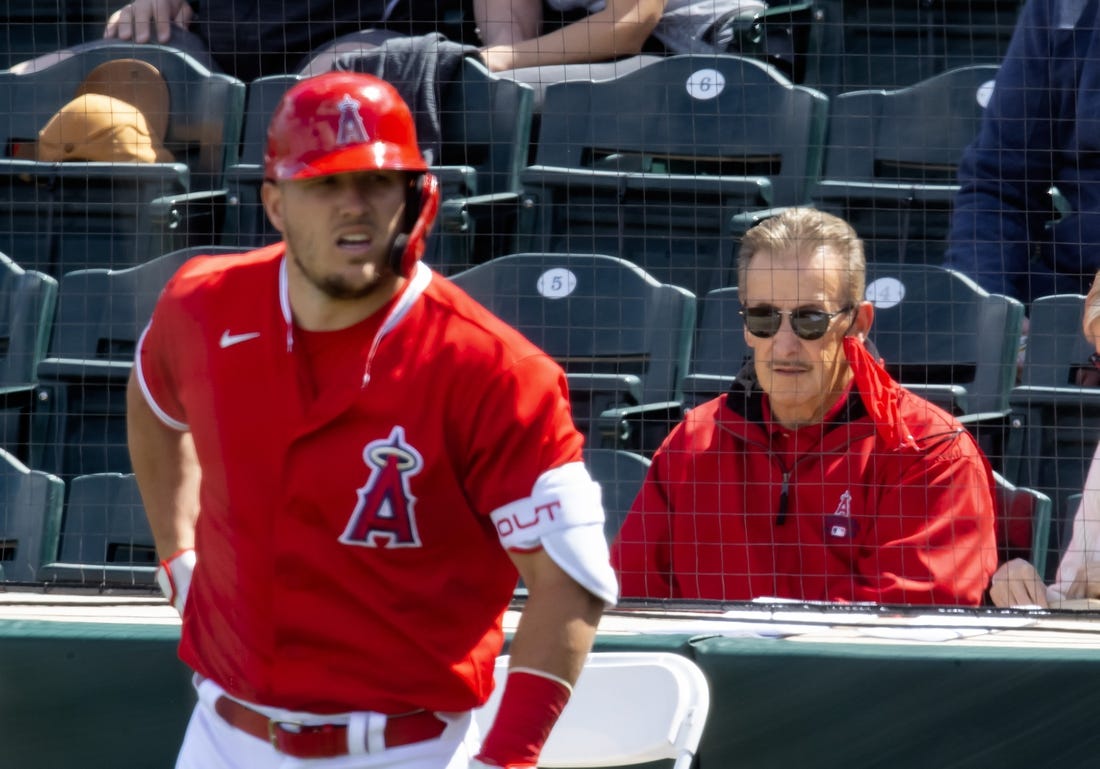Mar 16, 2021; Tempe, Arizona, USA; Los Angeles Angels owner Arte Moreno (right) and outfielder Mike Trout against the Cleveland Indians during a Spring Training game at Tempe Diablo Stadium. Mandatory Credit: Mark J. Rebilas-USA TODAY Sports