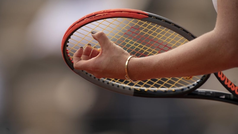 Jun 8, 2021; Paris, France; Detailed view of Anastasia Pavlyuchenkova's (RUS) fingernails on her racket during her match against Elena Rybakina (KAZ) on day 10 of the French Open at Stade Roland Garros. Mandatory Credit: Susan Mullane-USA TODAY Sports