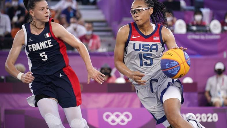 Jul 28, 2021; Tokyo, Japan; USA player Allisha Gray (15) dribbles while being defended by France player  Marie-Eve Paget (5) in the semifinal game during the Tokyo 2020 Olympic Summer Games at Aomi Urban Sports Park. Mandatory Credit: Andrew Nelles-USA TODAY Sports