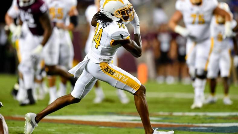 Sep 4, 2021;  College Station, Texas, USA;  Kent State Golden Flashes wide receiver Dante Cephas (14) receives the pass from Kent State Golden Flashes quarterback Dustin Crum (not shown) during the second quarter against the Texas A&M Aggies at Kyle Field. Mandatory Credit: Maria Lysaker-USA TODAY Sports