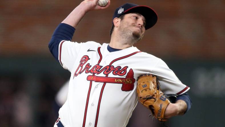 Oct 30, 2021; Atlanta, Georgia, USA; Atlanta Braves relief pitcher Luke Jackson (77) throws against the Houston Astros during the eighth inning of game four of the 2021 World Series at Truist Park. Mandatory Credit: Brett Davis-USA TODAY Sports