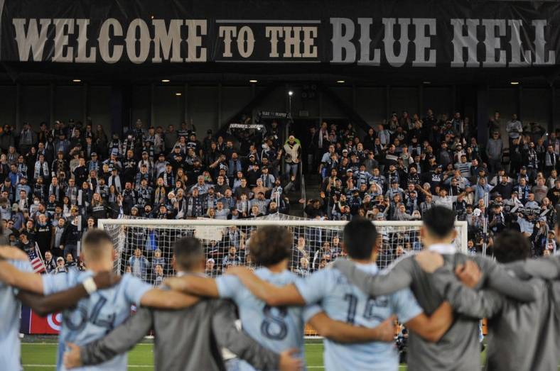 Nov 20, 2021; Kansas City, KS, USA; Sporting Kansas City players celebrate and salute the fans after defeating the Vancouver Whitecaps in a round one MLS Playoff game at Children's Mercy Park. Mandatory Credit: Amy Kontras-USA TODAY Sports