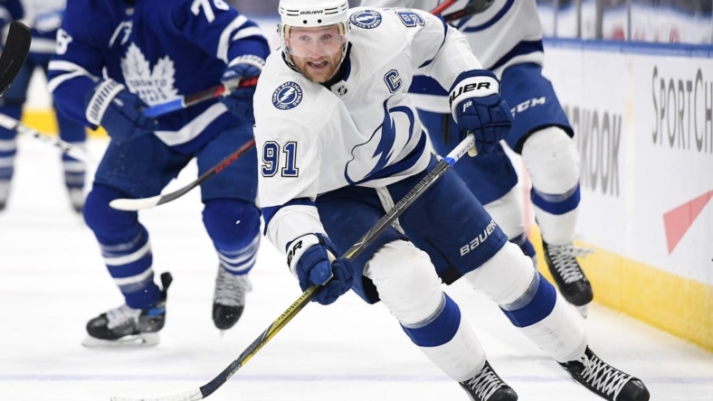 Dec 9, 2021; Toronto, Ontario, CAN; Tampa Bay Lightning forward Steve Stamkos (91) pursues the play against Toronto Maple Leafs in the second period at Scotiabank Arena. Mandatory Credit: Dan Hamilton-USA TODAY Sports