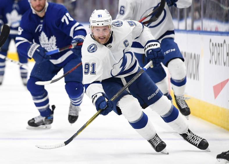 Dec 9, 2021; Toronto, Ontario, CAN; Tampa Bay Lightning forward Steve Stamkos (91) pursues the play against Toronto Maple Leafs in the second period at Scotiabank Arena. Mandatory Credit: Dan Hamilton-USA TODAY Sports