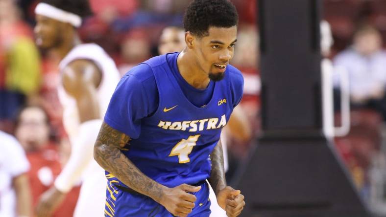 Dec 18, 2021; North Little Rock, Arkansas, USA; Hofstra Pride guard Aaron Estrada (4) celebrates after scoring in the second half against the Arkansas Razorbacks at Simmons Bank Arena. Hofstra won 89-81. Mandatory Credit: Nelson Chenault-USA TODAY Sports