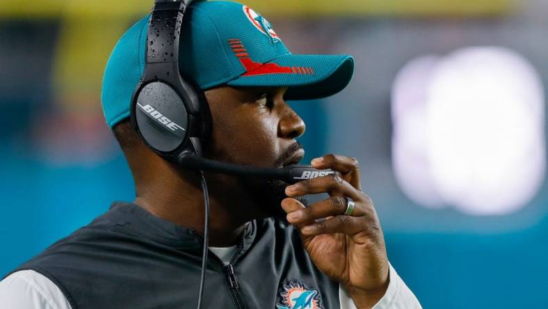 Jan 9, 2022; Miami Gardens, Florida, USA; Miami Dolphins head coach Brian Flores watches from the sideline during the second quarter of the game against the New England Patriots at Hard Rock Stadium. Mandatory Credit: Sam Navarro-USA TODAY Sports