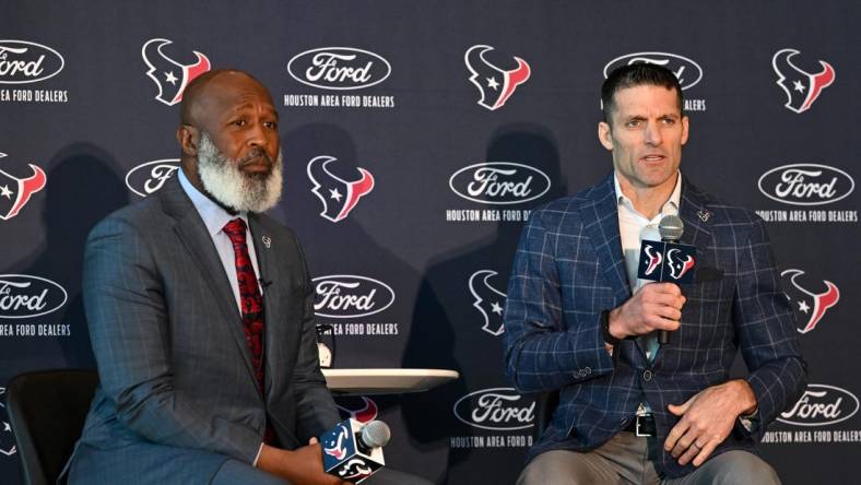 Feb 8, 2022; Houston, TX, USA; Houston Texans new head coach Lovie Smith (left) and general manager Nick Caserio (right) speak during the introductory press conference at NRG Stadium. Mandatory Credit: Maria Lysaker-USA TODAY Sports