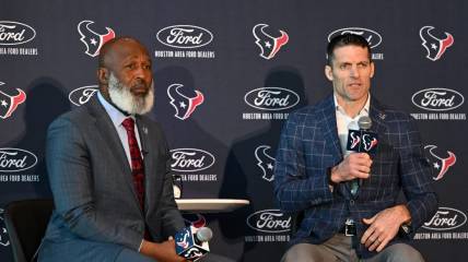 Feb 8, 2022; Houston, TX, USA; Houston Texans new head coach Lovie Smith (left) and general manager Nick Caserio (right) speak during the introductory press conference at NRG Stadium. Mandatory Credit: Maria Lysaker-USA TODAY Sports