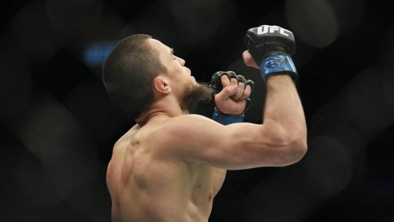 Mar 5, 2022; Las Vegas, Nevada, UNITED STATES; Umar Nurmagomedov (blue gloves) celebrates after defeating Brian Kelleher (not pictured) during UFC 272 at T-Mobile Arena. Mandatory Credit: Stephen R. Sylvanie-USA TODAY Sports