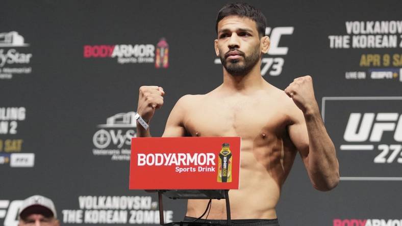 Apr 8, 2022; Jacksonville, FL, USA; Julio Arce on the scale during weigh ins for UFC 273 at VyStar Veterans Memorial Stadium. Mandatory Credit: David Yeazell-USA TODAY Sports