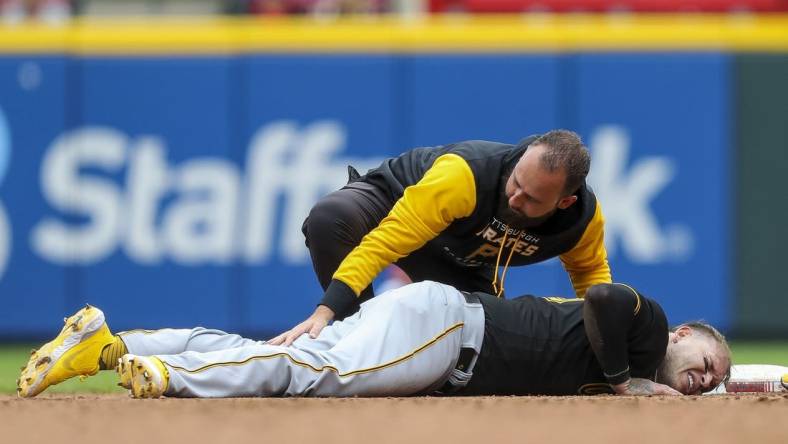 May 7, 2022; Cincinnati, Ohio, USA; Pittsburgh Pirates catcher Roberto Perez (55) lies on second injured in the eighth inning against the Cincinnati Reds at Great American Ball Park. Mandatory Credit: Katie Stratman-USA TODAY Sports