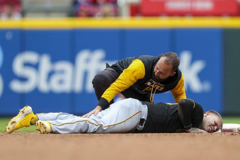 May 7, 2022; Cincinnati, Ohio, USA; Pittsburgh Pirates catcher Roberto Perez (55) lies on second injured in the eighth inning against the Cincinnati Reds at Great American Ball Park. Mandatory Credit: Katie Stratman-USA TODAY Sports