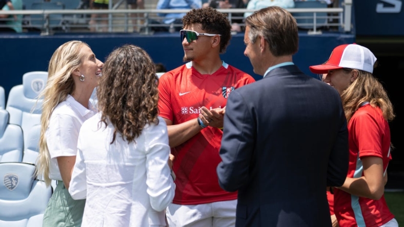 May 30, 2022; Kansas City, Kansas, USA; Kansas City Chiefs quarterback Patrick Mahomes talks with Kansas City Current owners, his wife Brittany and Chris and Angie Long, before a match against Racing Louisville FC at Children's Mercy Park. Mandatory Credit: Amy Kontras-USA TODAY Sports