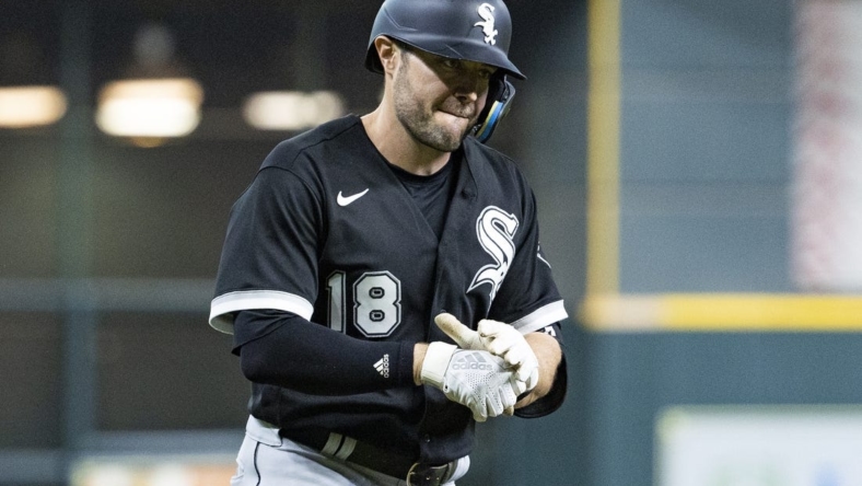 Jun 17, 2022; Houston, Texas, USA; Chicago White Sox left fielder AJ Pollock (18) rounds the bases and reacts after hitting a three run home run against the Houston Astros in the third inning at Minute Maid Park. Mandatory Credit: Thomas B. Shea-USA TODAY Sports
