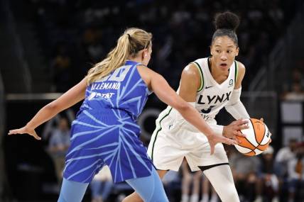 Jun 26, 2022; Chicago, Illinois, USA; Minnesota Lynx forward Aerial Powers (3) looks to pass the ball against Chicago Sky guard Julie Allemand (20) during the second half of a WNBA game at Wintrust Arena. Mandatory Credit: Kamil Krzaczynski-USA TODAY Sports