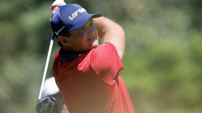 Jun 30, 2022; Portland, Oregon, USA; Patrick Reed watches his drive on the second hole during the first round of the LIV Golf tournament at Pumpkin Ridge Golf Club. Mandatory Credit: Soobum Im-USA TODAY Sports